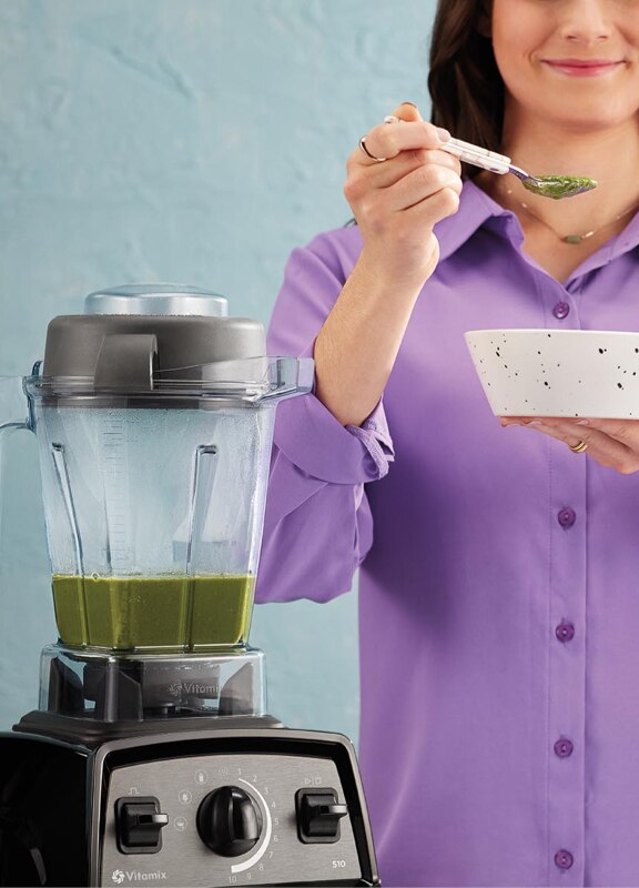 Woman enjoying soup from Propel blender