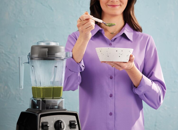 Woman enjoying soup from Propel blender