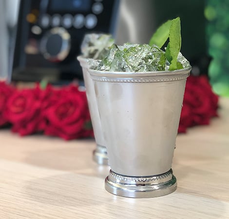 Mint Julep Mint Julep V3 in a glass cup featuring Aer Disc